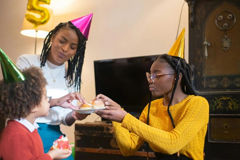 a woman handing a piece of cake to a little girl, a portrait, pexels, party hats, photo of a black woman, avatar image, industrial party