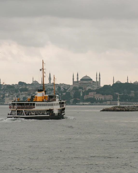 a large boat traveling across a large body of water, a colorized photo, pexels contest winner, hurufiyya, istanbul, non-binary, grey, lgbt