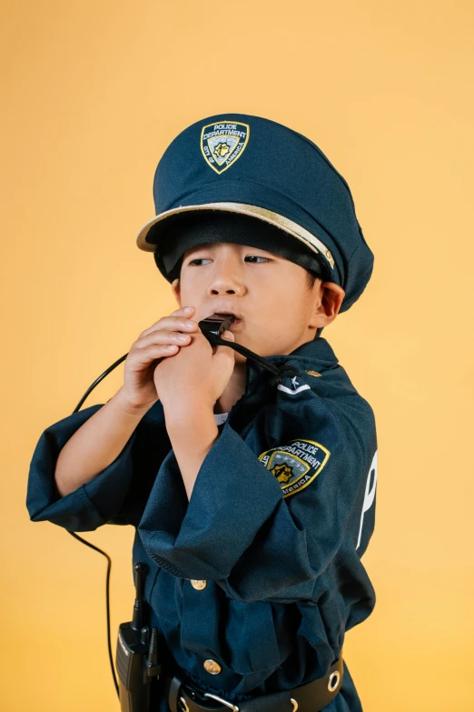 a little boy dressed up as a police officer, an album cover, by Alison Geissler, trending on pexels, pop art, rapping into microphone, 🚿🗝📝, roleplay, yanjun chengt