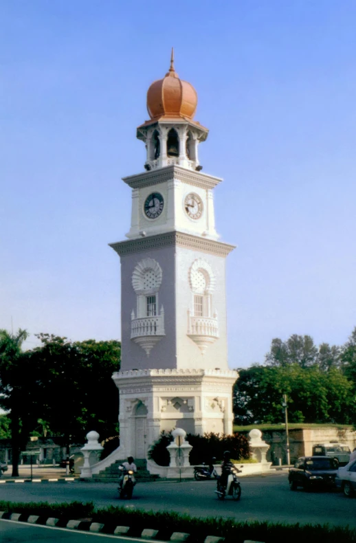 a tall clock tower sitting on the side of a road, by Basuki Abdullah, art nouveau, in 2 0 0 2, elevation view, town square, 1997 )