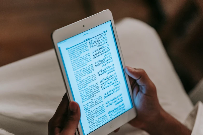 a close up of a person holding a tablet computer, biblical image, riyahd cassiem, thumbnail, contain