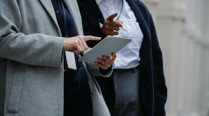 a couple of men standing next to each other, trending on unsplash, private press, using a magical tablet, professional closeup photo, grey, schools