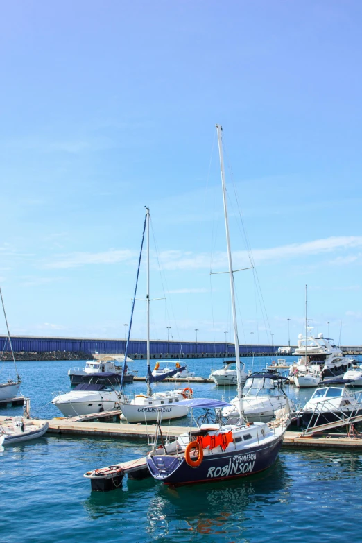 a number of boats in a body of water, azores, family friendly, square, very high resolution