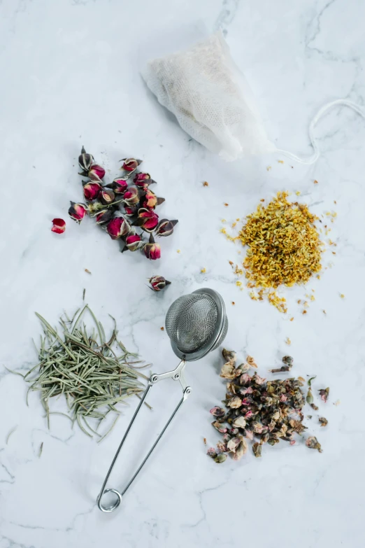 a table topped with different types of herbs, a still life, by Jessie Algie, trending on unsplash, made of dried flowers, detailed product image, straining, close-up product photo