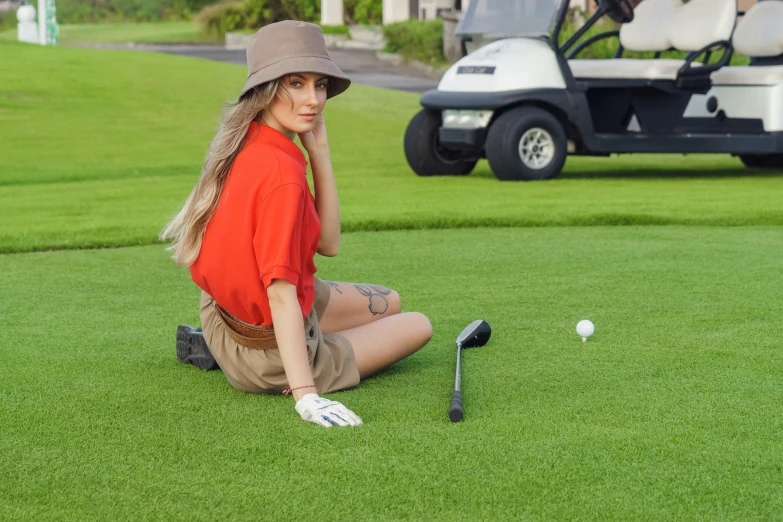 a woman sitting on the ground next to a golf ball, avatar image, premium, helmet off, lush green