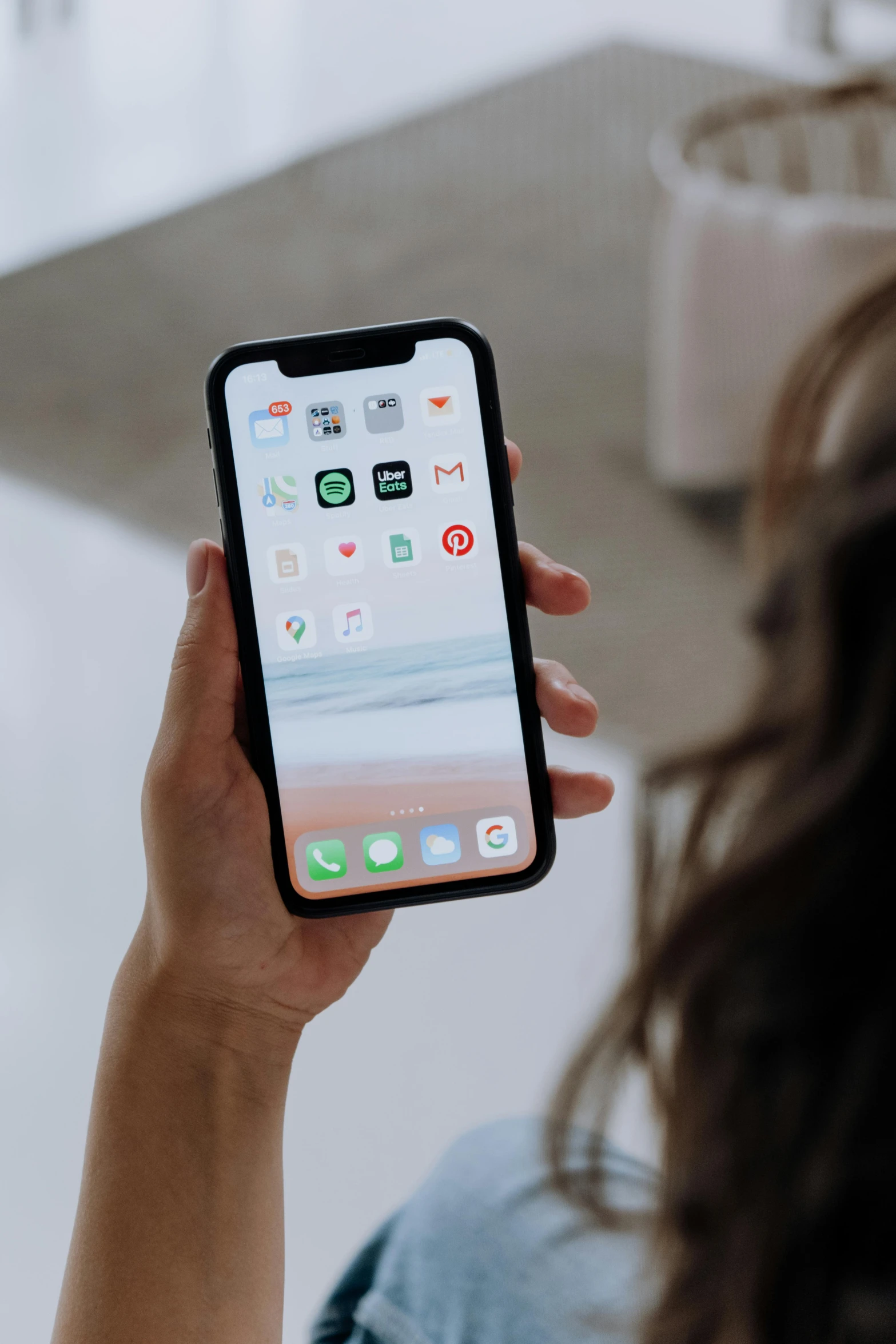 a woman holding an iphone up to her face, trending on pexels, ios app icon, modern minimalist f 2 0, low quality photo, iphone video