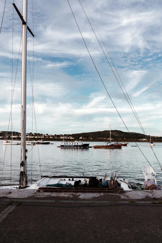 a boat that is sitting in the water, inspired by Wilhelm Marstrand, happening, docked at harbor, croatian coastline, a cozy, bored ape yacht club