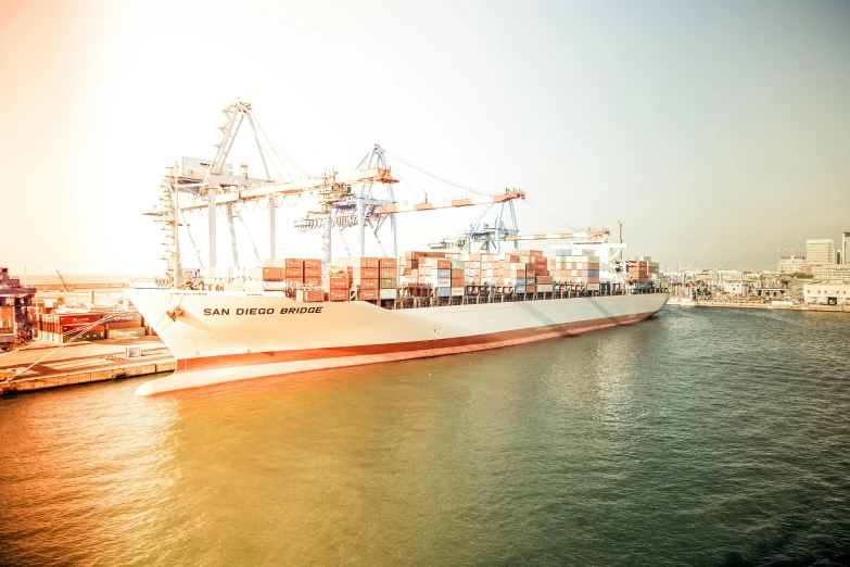 a large cargo ship in a large body of water, by Daniel Lieske, pexels contest winner, docked at harbor, beautiful soft light, avatar image, california