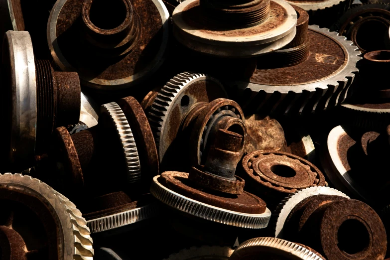 a pile of rusty gears sitting next to each other, unsplash, assemblage, instagram post, brown, high-contrast, made of metal