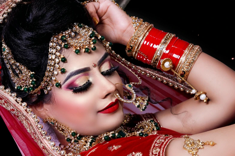 a woman dressed in a red and gold outfit, a portrait, trending on pixabay, hurufiyya, thick fancy makeup, india, thumbnail, wedding