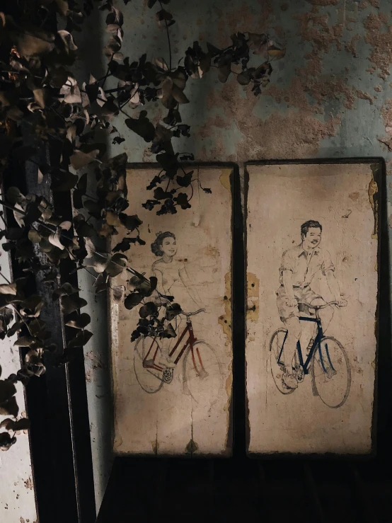 a couple of paintings hanging on the side of a wall, by Lucia Peka, graffiti, cycles, 1900's, ((portrait)), indoor picture