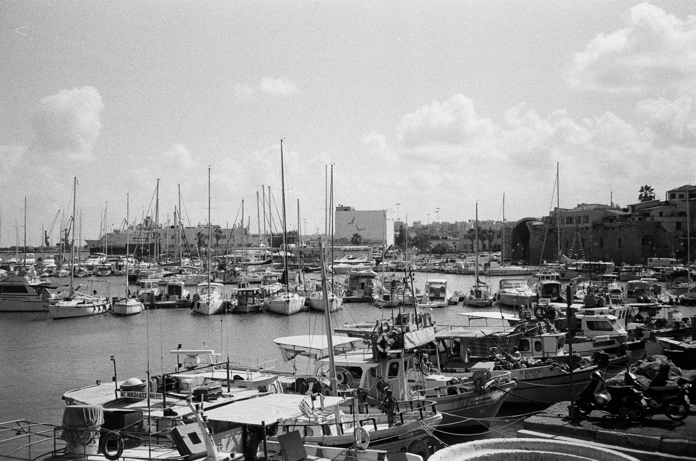 a black and white photo of a harbor full of boats, by Mathias Kollros, christina kritkou, various posed, kodak photograph, hana alisa omer