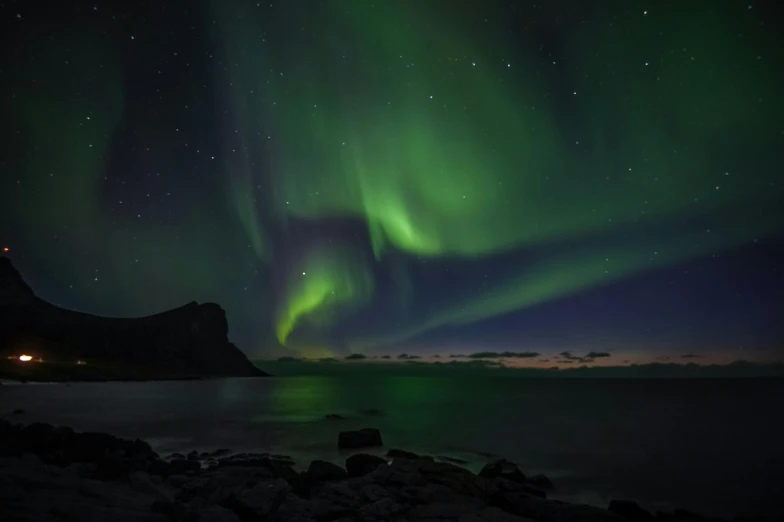 the aurora lights in the sky over a body of water, pexels contest winner, hurufiyya, nordic crown, green accent lighting, grey, black