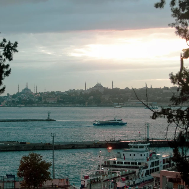 a boat that is sitting in the water, inspired by Elsa Bleda, pexels contest winner, hurufiyya, surrounding the city, mixture turkish and russian, 2 0 0 0's photo, fan favorite