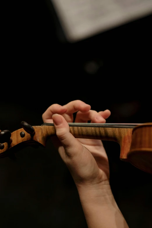 a close up of a person playing a violin, by David Simpson, photographed for reuters, square, 15081959 21121991 01012000 4k, hand