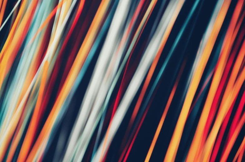 a blurry photo of multicolored lines, by Matija Jama, unsplash, lyrical abstraction, cords, orange racing stripes, instagram picture, sleek spines