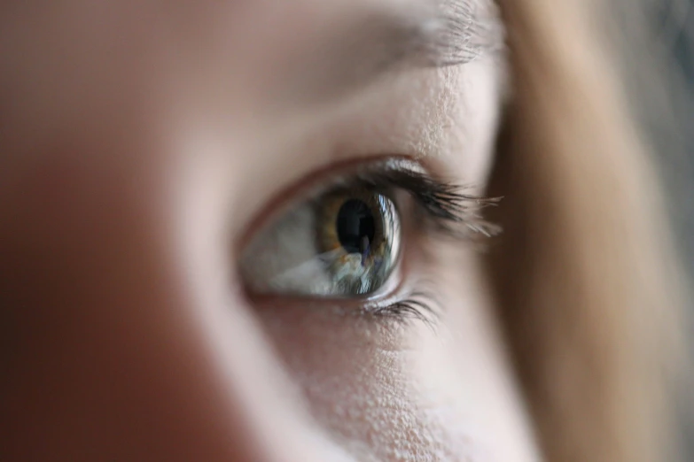 a close up of a person's eye, trending on pexels, tiny girl looking on, face and body clearly visible, grey contacts, people watching