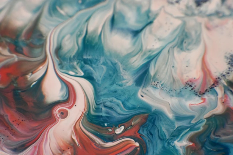 a close up of a painting on a table, inspired by Yanjun Cheng, trending on pexels, generative art, swirling liquids, teal silver red, blue marble, pink white turquoise