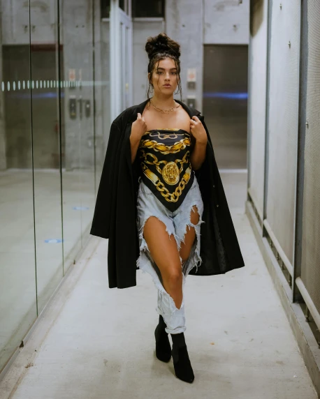 a woman that is standing in a hallway, by Robbie Trevino, renaissance, dua lipa, black body, fashion show photo, michael angelo inspired