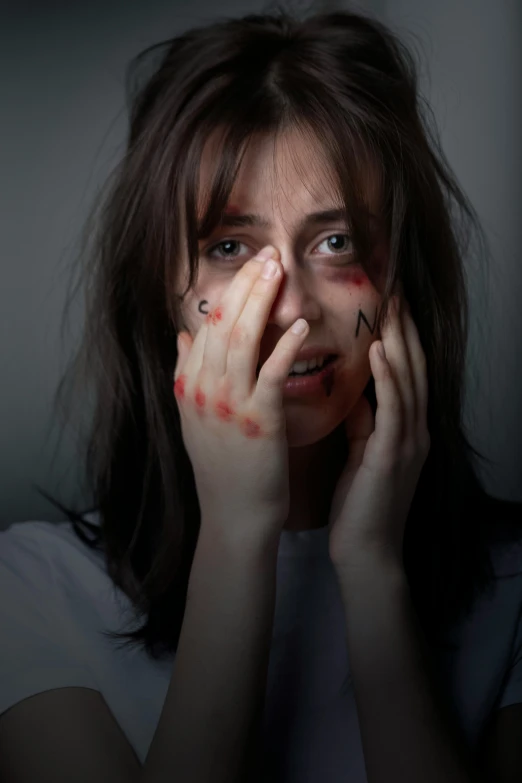 a woman with blood all over her face, trending on pexels, antipodeans, natalia dyer, hands shielding face, frightened look, square