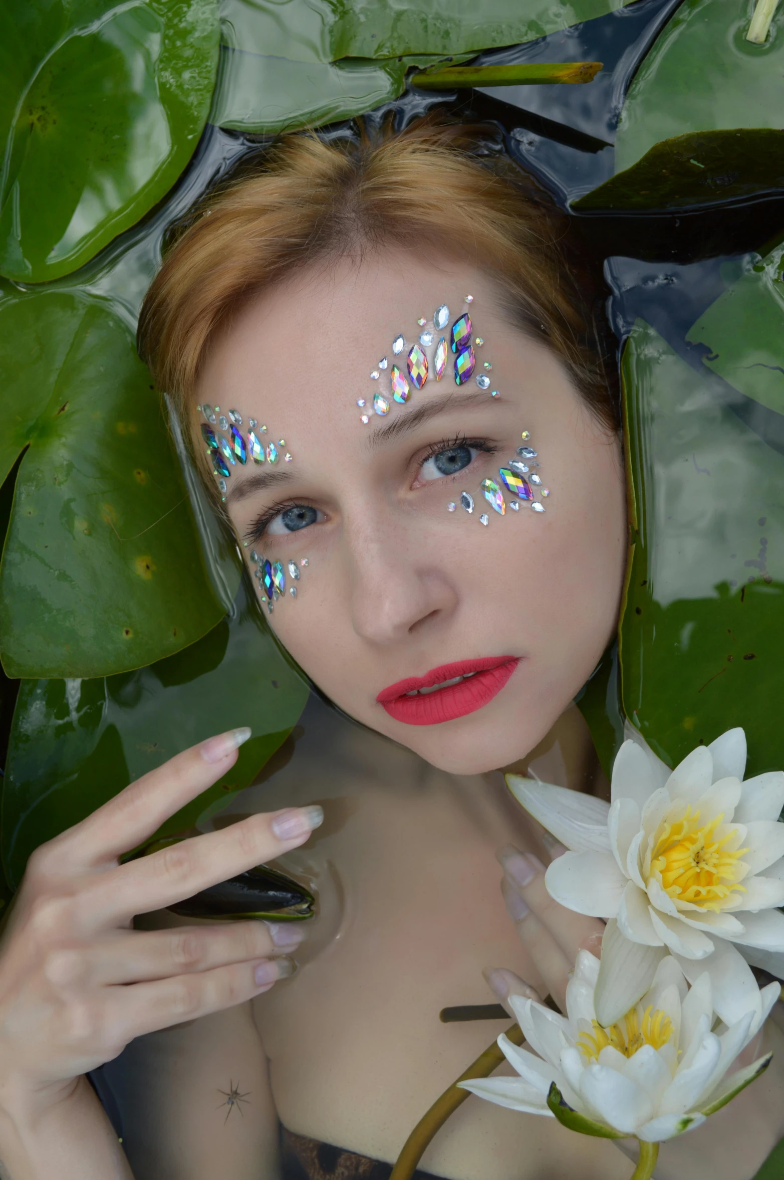 a close up of a person in a body of water with a flower, inspired by Hedi Xandt, art nouveau, sparkles on eyelids, lily pads, avatar image, selfie photo