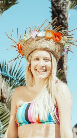 a woman wearing a straw hat on top of her head, a colorized photo, inspired by Maties Palau Ferré, pexels contest winner, a blond, tiki, wearing a floral crown, uploaded