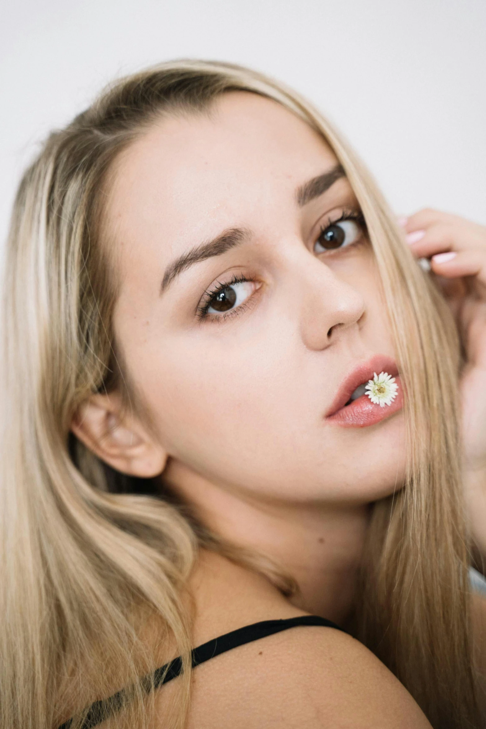 a woman brushing her teeth with a toothbrush, inspired by Elsa Bleda, trending on pexels, photorealism, long blonde hair and big eyes, flower, square nose, 5 0 0 px models