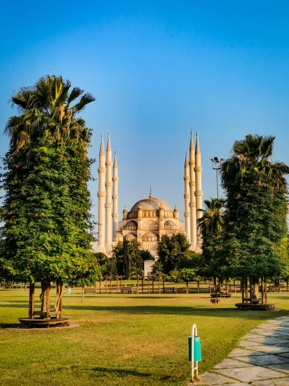 the blue mosque in the middle of a park, a colorized photo, pexels contest winner, 8k hdr morning light, from luxor, square, 2022 photograph