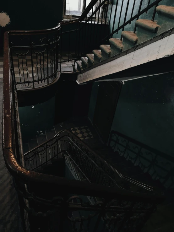 a couple of stairs that are next to each other, inspired by Elsa Bleda, unsplash contest winner, renaissance, playstation 2 horror game, low quality photo