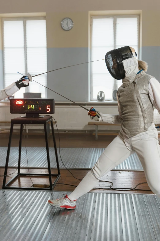 a couple of people that are standing in a room, fencing, physics, no cropping, female