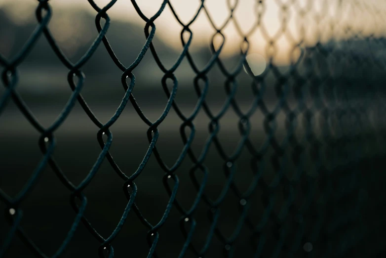 a close up of a chain link fence, an album cover, inspired by Elsa Bleda, unsplash, hurufiyya, background image, alessio albi, hd wallpaper