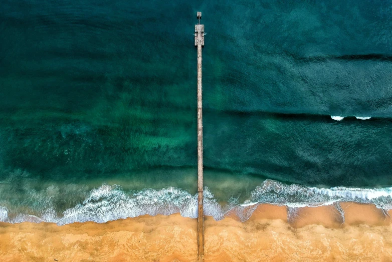 a large body of water next to a beach, by Peter Churcher, unsplash contest winner, telephone pole, aerial illustration, manly, david a trampier