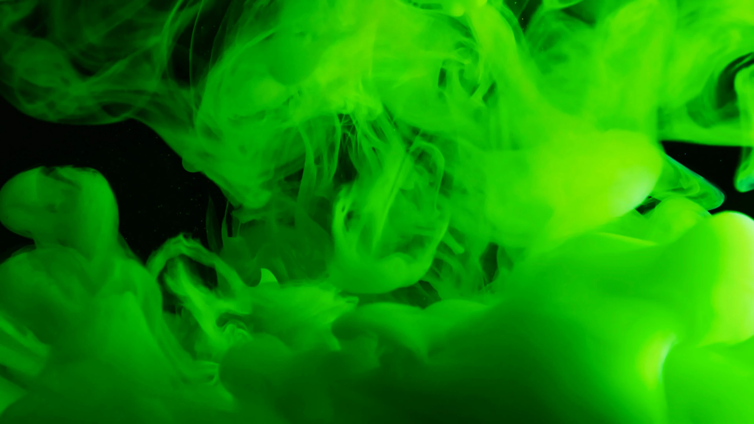 a close up of a person holding a cell phone, inspired by Otto Piene, pexels, process art, green smoke, ghost neon, abstraction chemicals, bright green dark orange