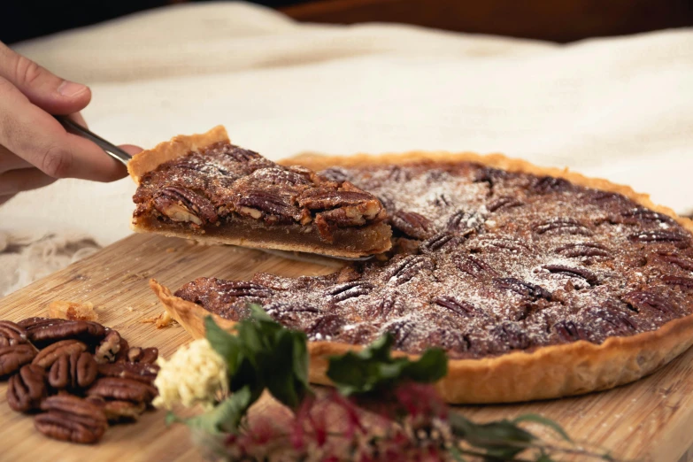 a pie sitting on top of a wooden cutting board, inspired by Richmond Barthé, pexels contest winner, festive, cinnamon, various posed, frontal shot