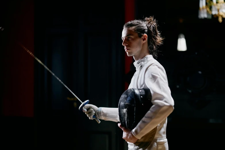 a woman in fencing gear holding a sword, a portrait, unsplash, a handsome, plating, alex heywood, profile image