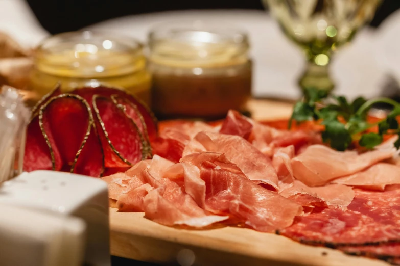 a wooden cutting board topped with meat and veggies, by Niko Henrichon, renaissance, in the evening, fan favorite, munich, pink