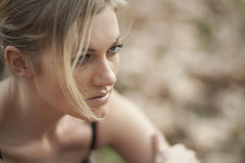 a close up of a woman with a cell phone, a portrait, by Lee Loughridge, unsplash, side portrait rugged girl, medium format. soft light, blonde women, natural make-up