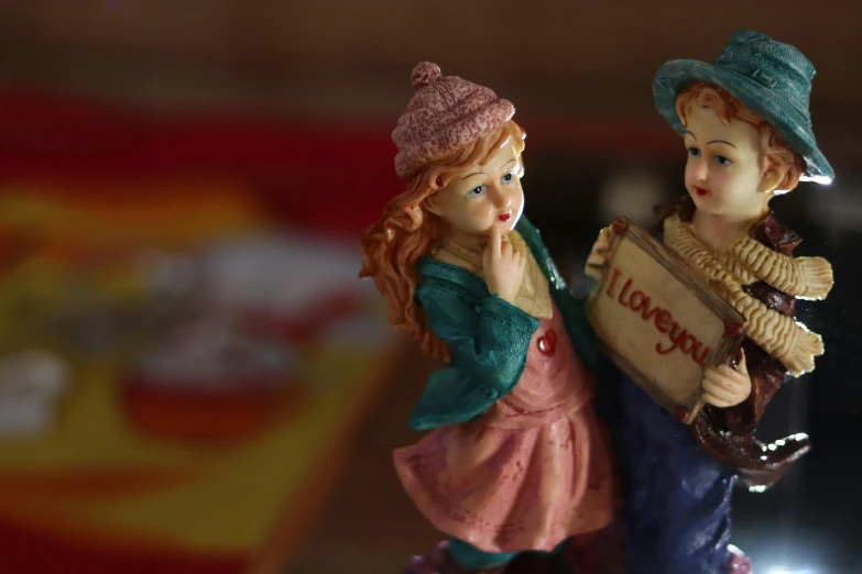 a couple of figurines sitting on top of a table, a portrait, by Sylvia Wishart, unsplash, gypsy, happy meal toy, two girls, 15081959 21121991 01012000 4k