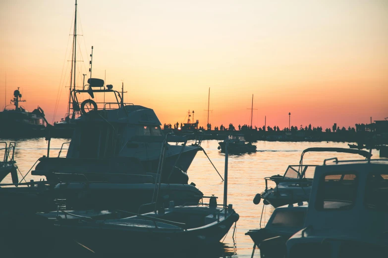 a number of boats in a body of water, pexels contest winner, summer evening, view from the side”, mina petrovic, overexposed photograph