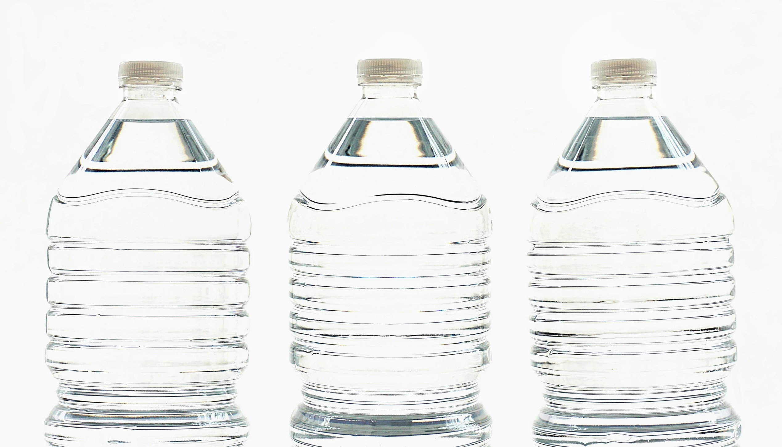 three bottles of water sitting next to each other, a digital rendering, by Nicolette Macnamara, pexels, plasticien, white, backdrop, ready to eat, pictured from the shoulders up