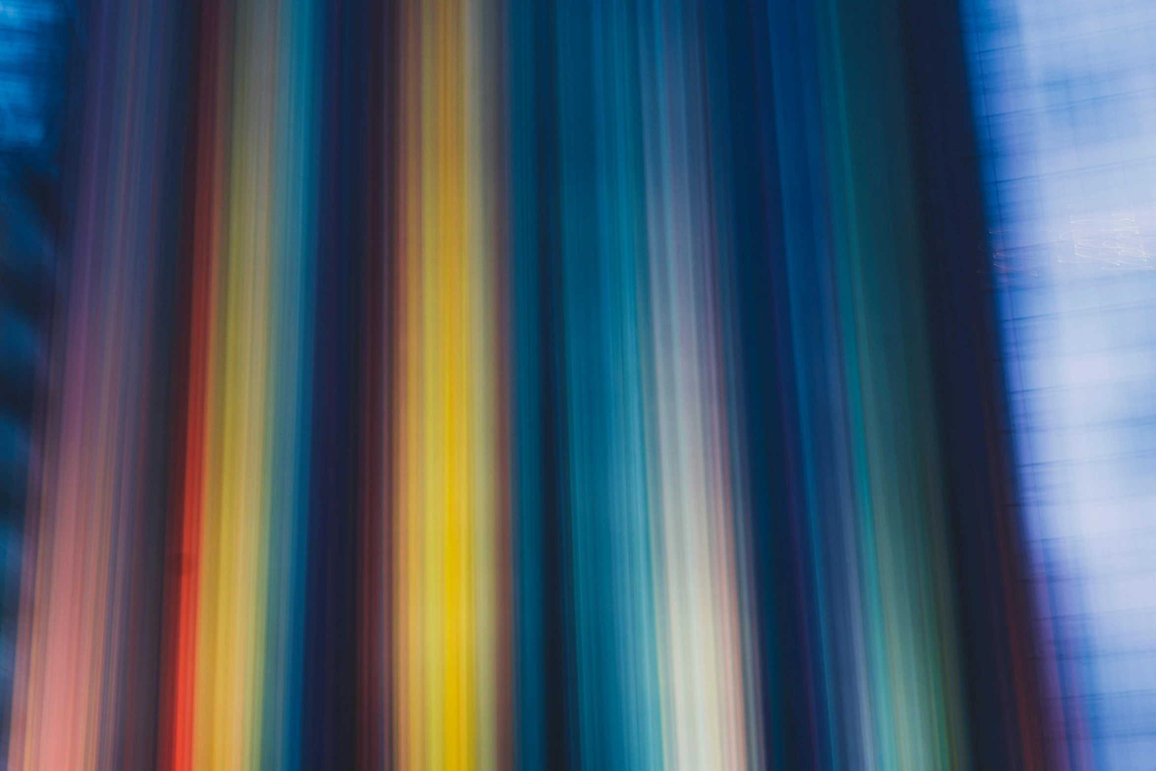 a blurry photo of a multicolored curtain, inspired by Richter, unsplash, blue and yellow lighting, color ( sony a 7 r iv, long exposure, indigo rainbow