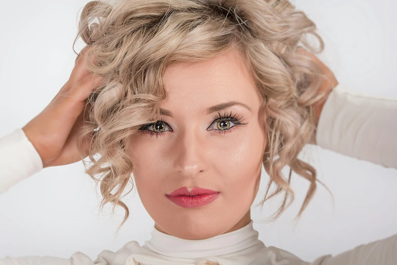 a woman with blonde hair is posing for a picture, curls on top, modelling, zoomed in, professional photo