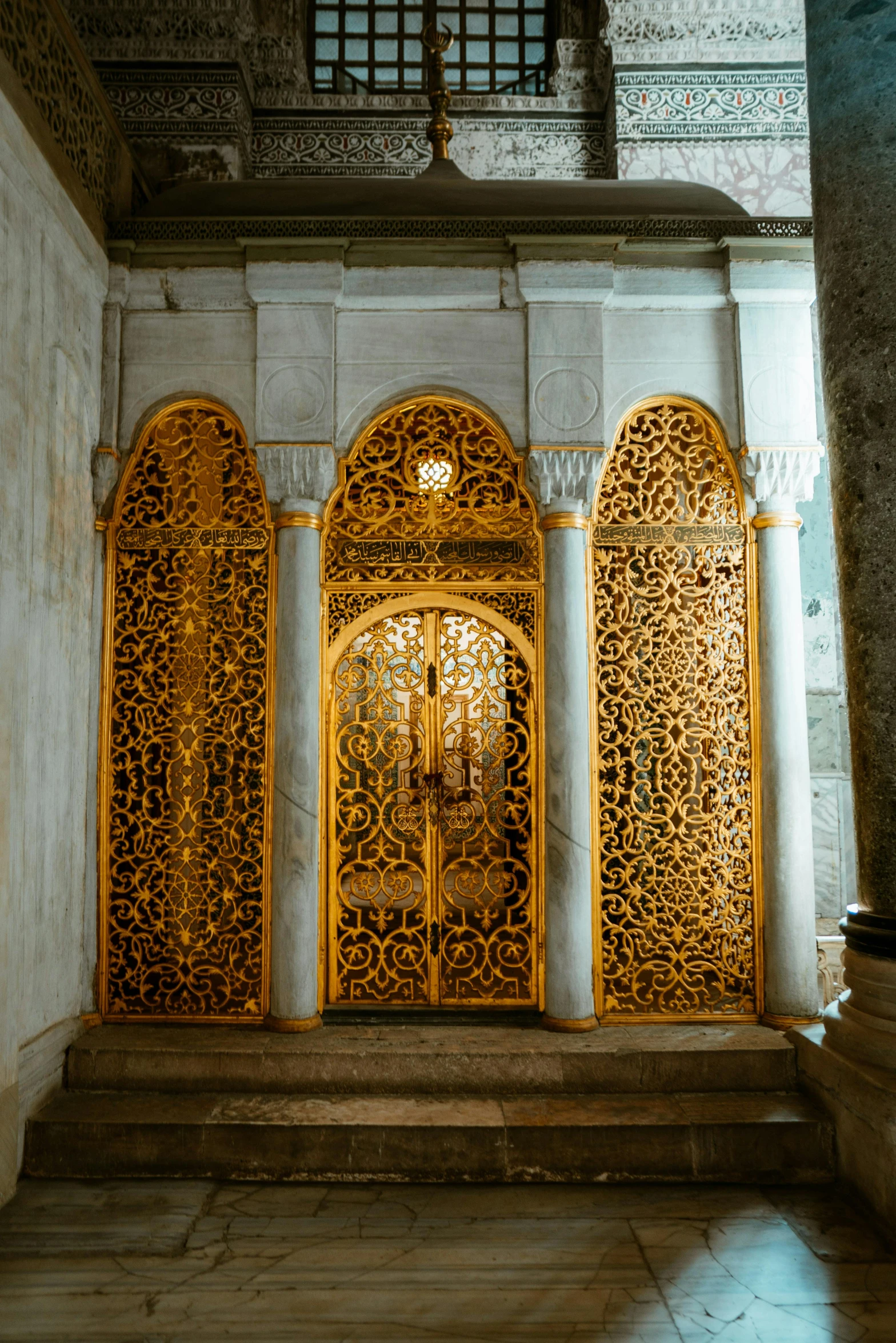 a close up of a doorway in a building, a marble sculpture, inspired by Osman Hamdi Bey, pexels contest winner, baroque, golden etched armor, inside the tomb of jesus, istanbul, part of the screen