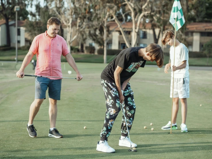 a group of people playing a game of golf, a portrait, by Meredith Dillman, pexels contest winner, happening, low quality footage, vitalik buterin, dad bod, background image