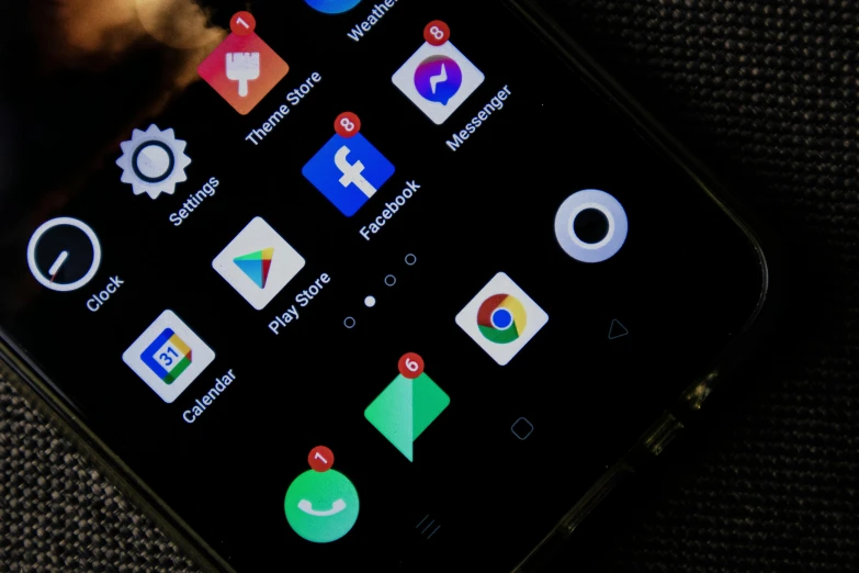 a close up of a cell phone on a table, pexels, realism, detailed face of an android, app icon, yin yang, photograph credit: ap