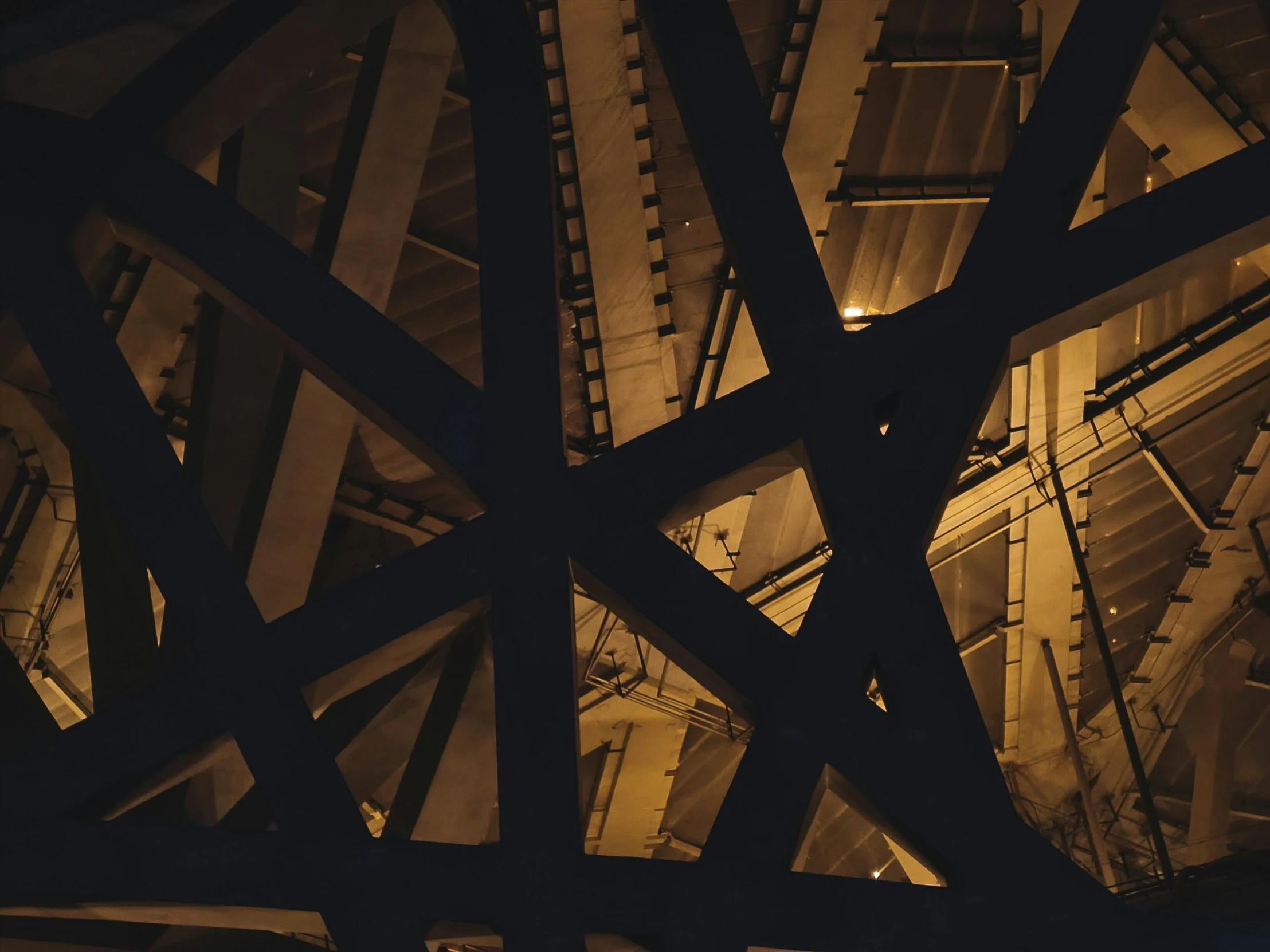 a close up of a train track at night, inspired by George Ault, pexels contest winner, precisionism, high bridges, complex ceiling, profile image, gold and black metal