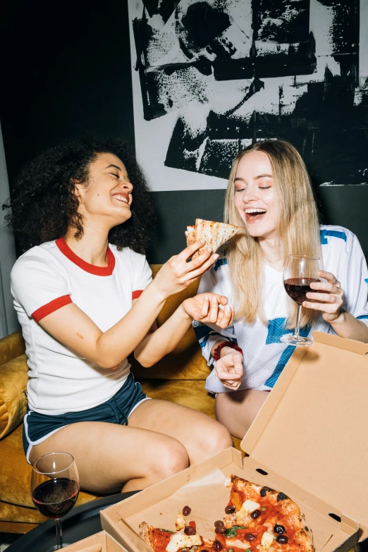 two women sitting on a couch eating pizza, pexels contest winner, college party, profile image, pizza box, caucasian