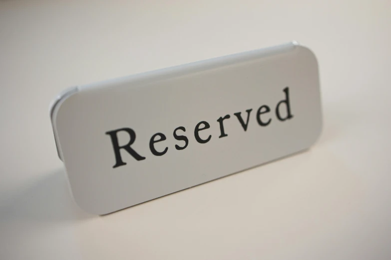 a close up of a reserved sign on a table, by Jan Cox, unsplash, resin miniature, asset on grey background, highly detailed engraving, recessed