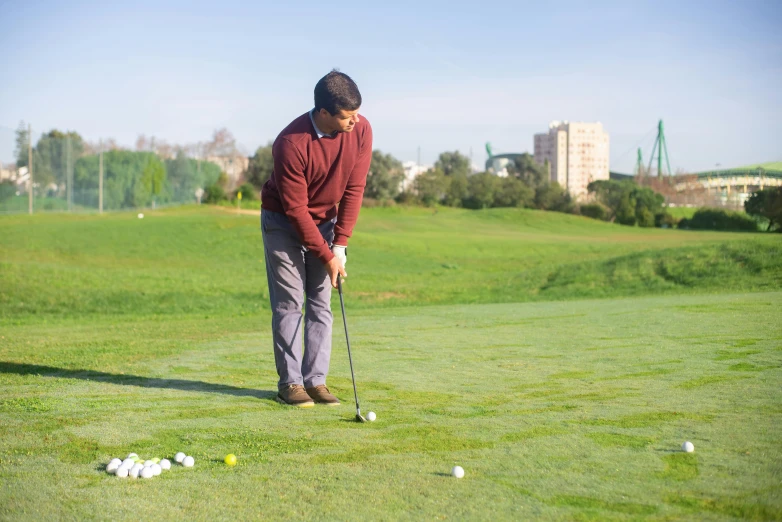 a man standing on top of a green field holding a golf club, arrendajo in avila pinewood, launching a straight ball, high quality product image”