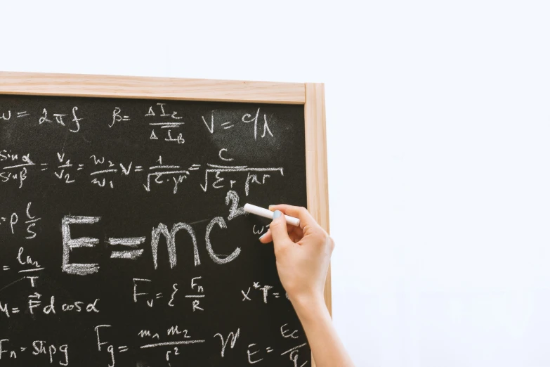 a person writing on a blackboard with chalk, by Matthias Stom, trending on unsplash, analytical art, equations, background image, m. c. esher, a wooden